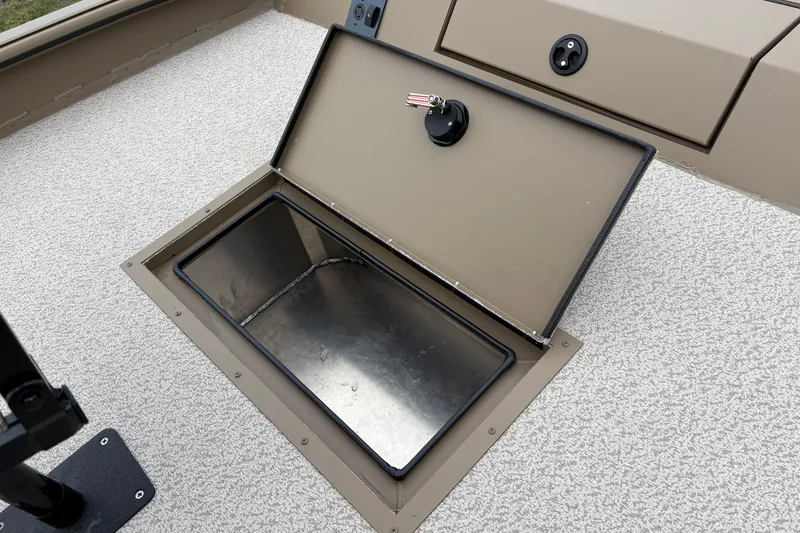 Slide: The Image of Open storage compartment on 2026 SeaArk Shadow 20V boat deck. - 20