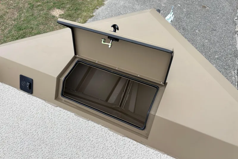Slide: The Image of Open storage compartment on 2026 SeaArk Shadow 20V boat, showcasing interior space. - 21