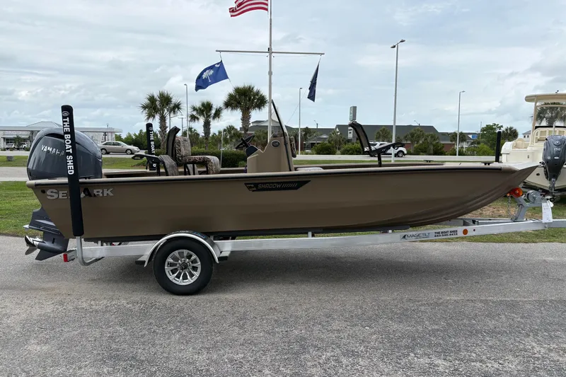 Slide: The Image of 2026 SeaArk Shadow 20V boat on trailer, featuring Yamaha outboard motor, parked outdoors. - 4