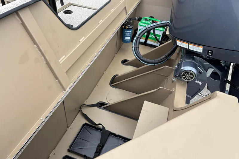 Slide: The Image of Interior view of a 2026 SeaArk Shadow 20V boat, showcasing engine and storage compartments. - 9
