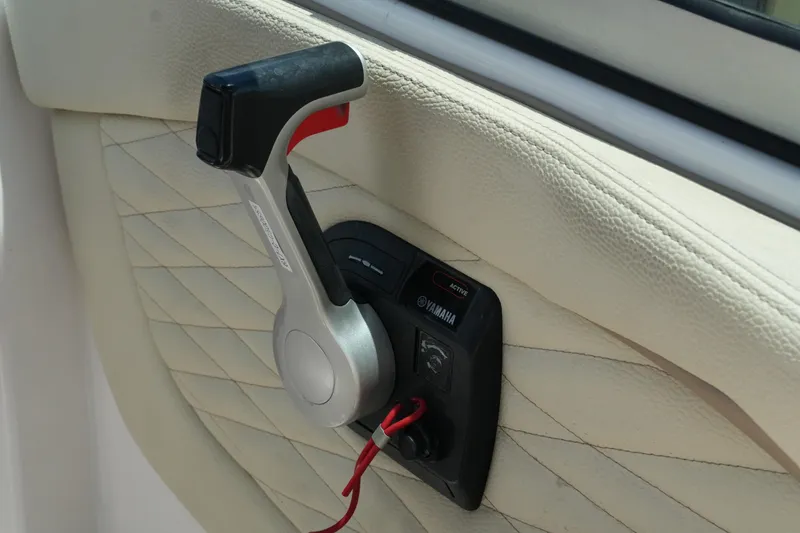 Slide: The Image of Throttle control lever on a 2019 Regal 23 OBX boat, featuring Yamaha branding. - 27