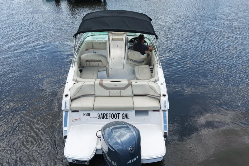 Slide: The Image of 2019 Regal 23 OBX boat on water, featuring spacious seating and Yamaha outboard motor. - 8