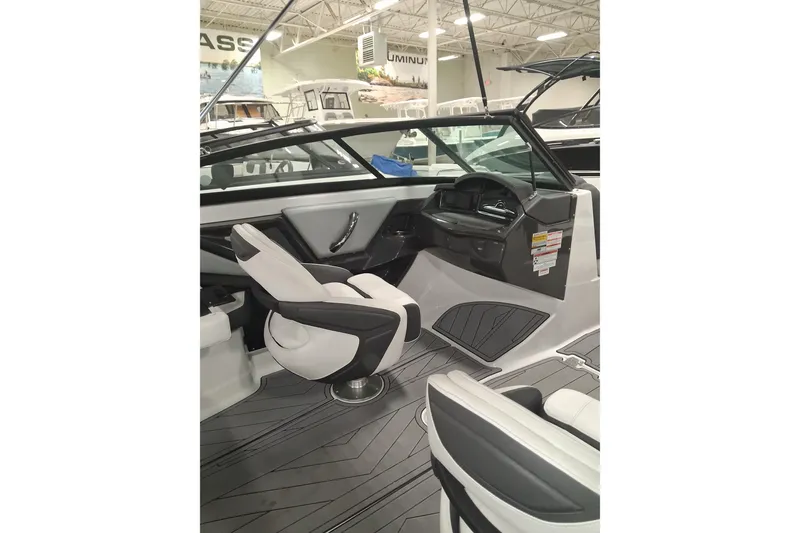 Slide: The Image of 2022 Monterey 218SS Super Sport boat interior with sleek seating and modern dashboard design. - 11