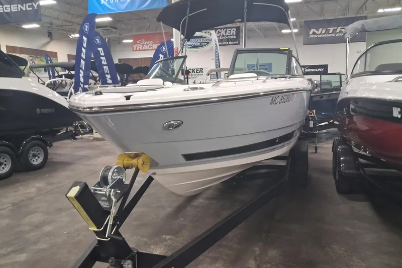 Slide: The Image of 2022 Monterey 218SS Super Sport boat displayed indoors on a trailer. - 4