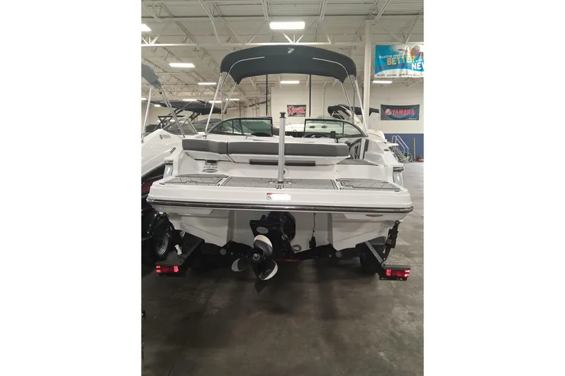 Slide: The Image of 2022 Monterey 218SS Super Sport boat displayed indoors, rear view with canopy. - 5