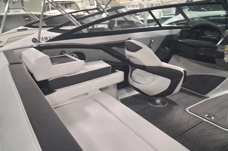 Slide: The Image of Interior of a 2022 Monterey 218SS Super Sport boat, featuring sleek seating and modern design. - 8