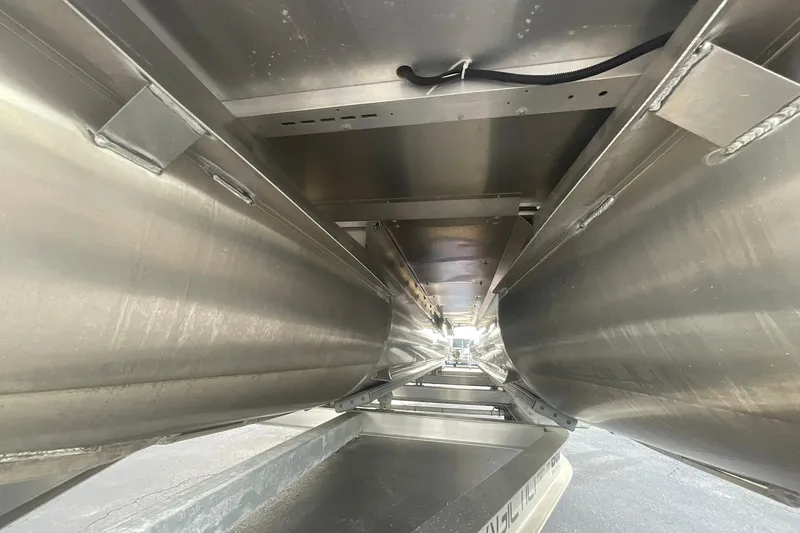 Slide: The Image of Underneath view of 2023 Crest Classic DLX 220 SLC pontoon boat structure. - 15