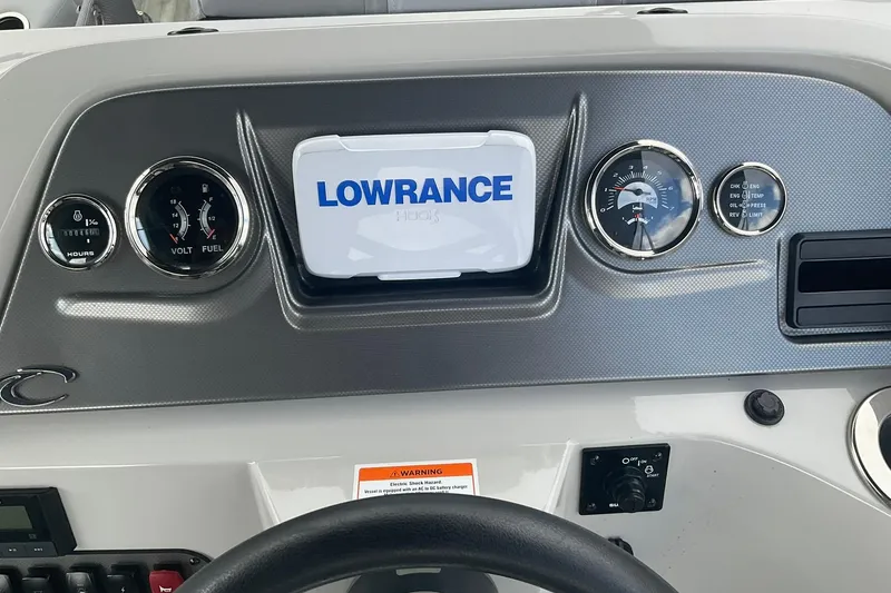 Slide: The Image of Dashboard of 2023 Crest Classic DLX 220 SLC with Lowrance display and gauges. - 25