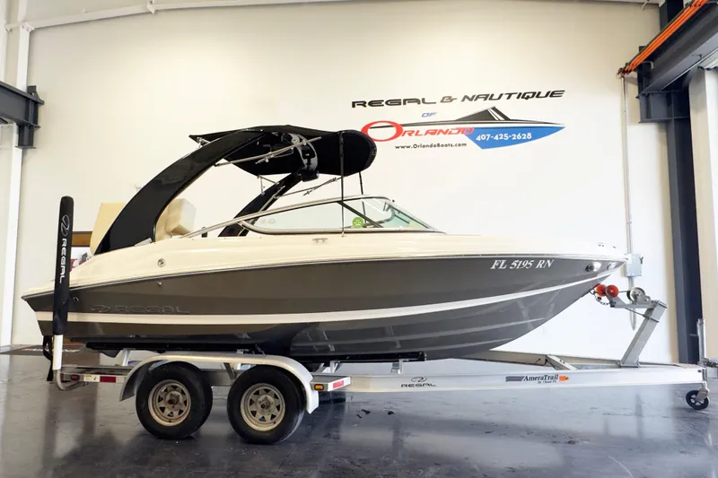 The Image of 2018 Regal 2000 ES Bowrider on trailer in showroom, side view. - 1