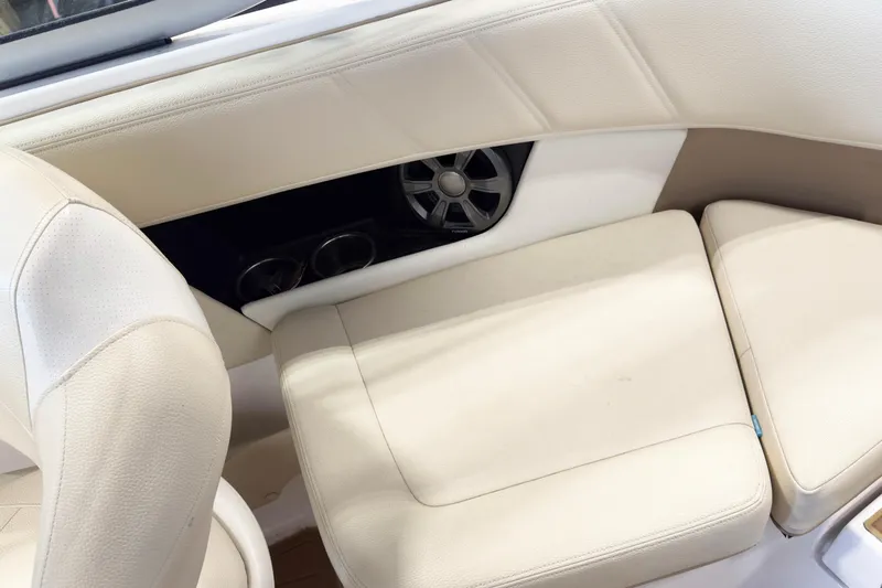 Slide: The Image of 2018 Regal 2000 ES Bowrider interior with beige seating and speaker detail. - 10