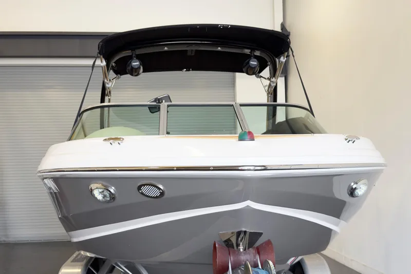 Slide: The Image of 2018 Regal 2000 ES Bowrider boat in showroom, front view with canopy. - 3