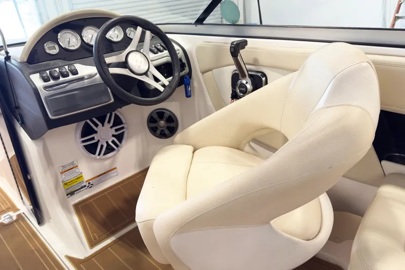 Slide: The Image of Interior of 2018 Regal 2000 ES Bowrider, featuring steering wheel and control panel. - 6