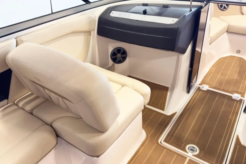 Slide: The Image of Interior of 2018 Regal 2000 ES Bowrider with beige seating and wood-style flooring. - 8