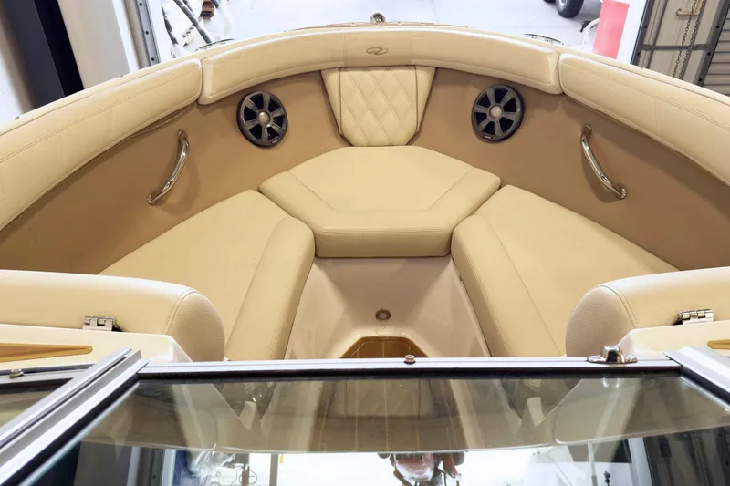 Slide: The Image of Luxurious interior of 2018 Regal 2000 ES Bowrider with beige seating and stainless steel accents. - 9