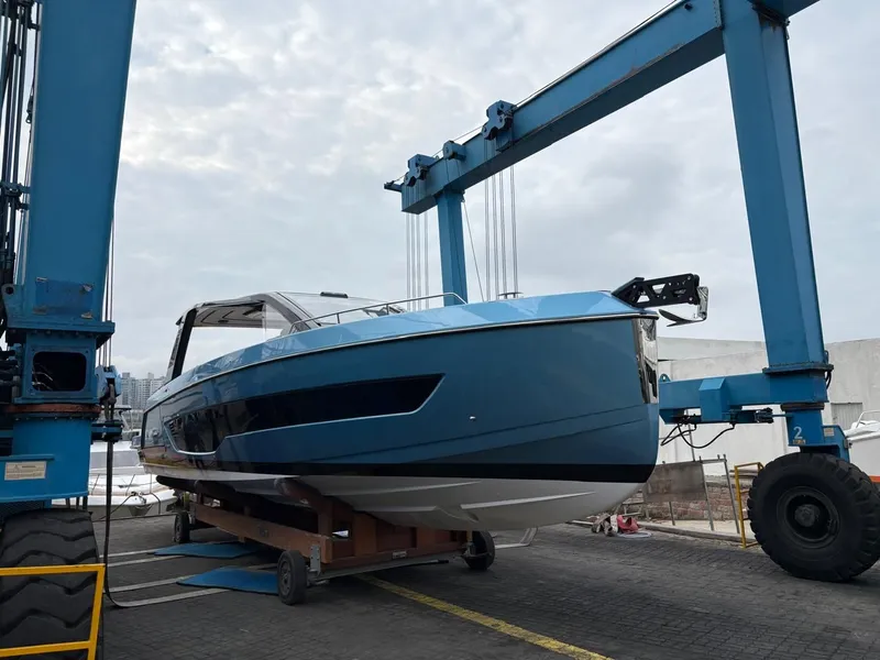 Slide: The Image of Schaefer V44 Yacht 2026 on crane, ready for launch. - 1