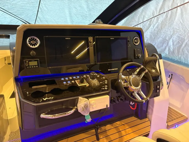 Slide: The Image of Schaefer V44 2026 yacht cockpit with modern controls and displays. - 15