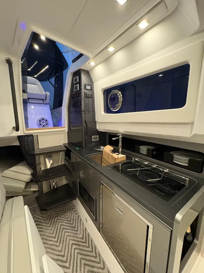 Slide: The Image of Interior of 2026 Schaefer V44 yacht featuring modern kitchen. - 16