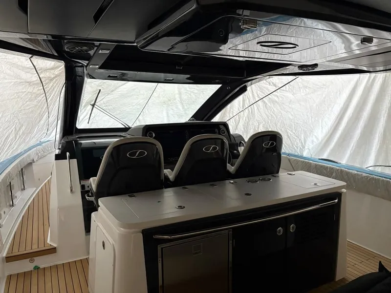Slide: The Image of Interior of Schaefer V44 yacht, 2026 model, featuring modern seating. - 7