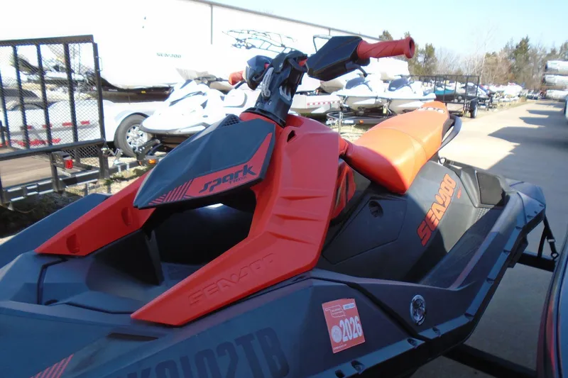The Image of 2022 Sea-Doo Spark Trixx 3up jet ski in vibrant red and black. - 0