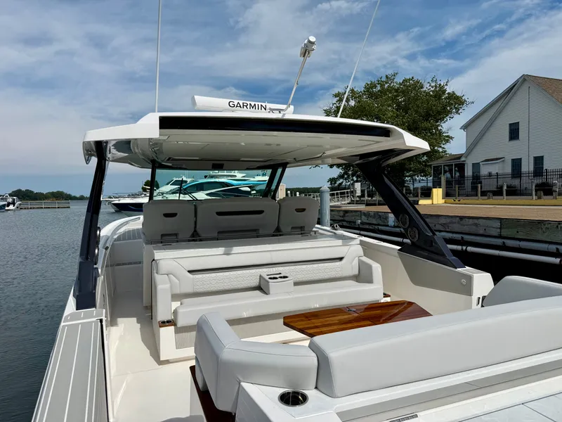 Slide: The Image of The image shows a 2027 Tiara Yachts 43LS with sleek, modern design and luxurious seating. - 36