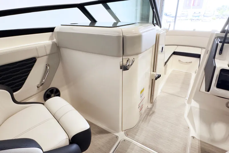 Slide: The Image of Interior of 2021 Sea Ray SPX 230 boat, featuring sleek seating and modern design. - 11