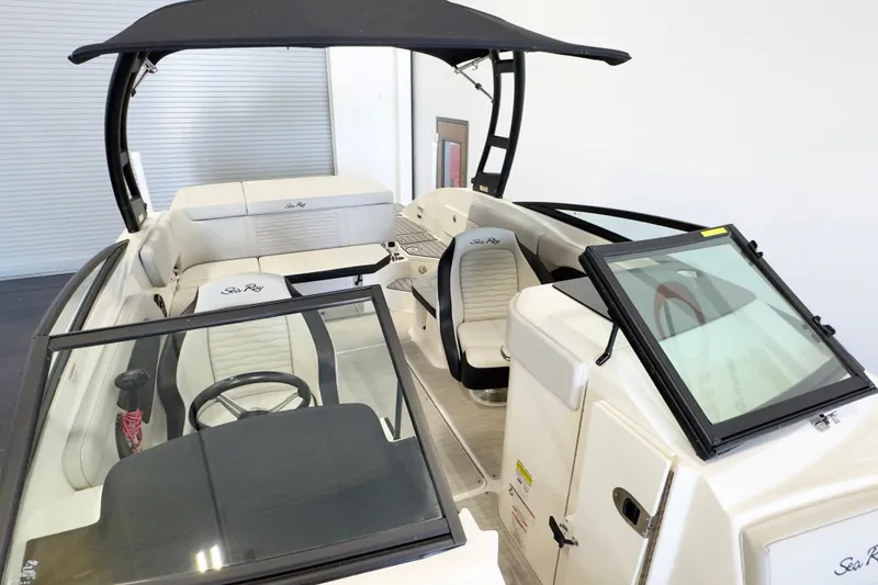 Slide: The Image of 2021 Sea Ray SPX 230 boat interior with sleek seating and modern design. - 6