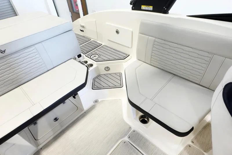 Slide: The Image of Interior seating of 2021 Sea Ray SPX 230 boat, featuring sleek, modern design and comfortable upholstery. - 8