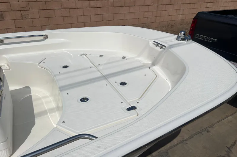Slide: The Image of 2019 Boston Whaler 170 Montauk boat deck, featuring spacious layout and sleek design. - 17