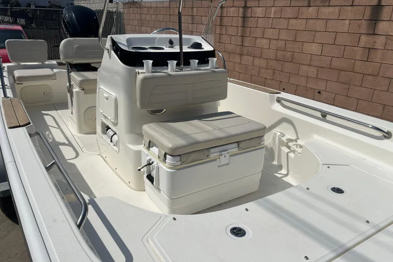 Slide: The Image of 2019 Boston Whaler 170 Montauk boat interior with seating and console. - 18