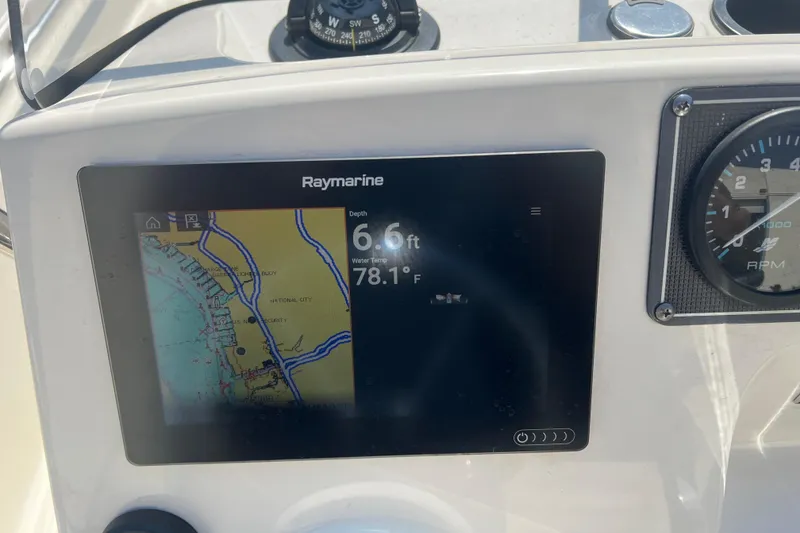 Slide: The Image of Raymarine display on 2019 Boston Whaler 170 Montauk showing depth and water temperature. - 23
