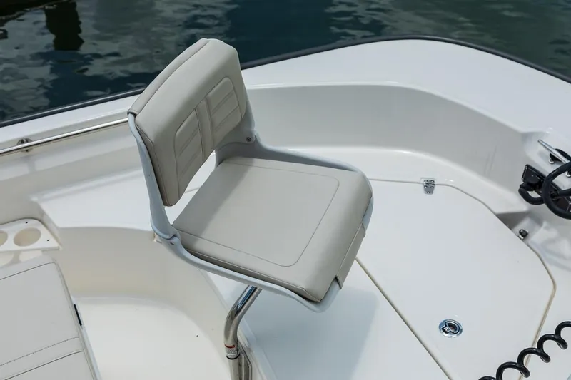 Slide: The Image of Manufacturer Provided Image: 2019 Boston Whaler 170 Montauk boat seat with white upholstery. - 29