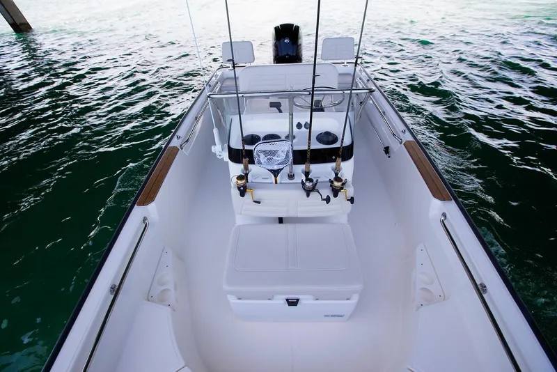 Slide: The Image of Manufacturer Provided Image: 2019 Boston Whaler 170 Montauk boat interior with fishing rods and seating. - 30