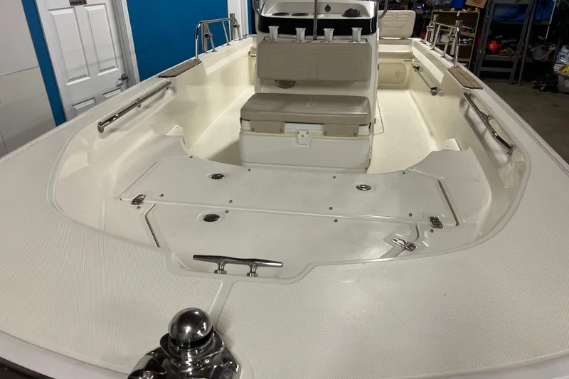 Slide: The Image of 2019 Boston Whaler 170 Montauk boat interior, featuring seating and storage compartments. - 4