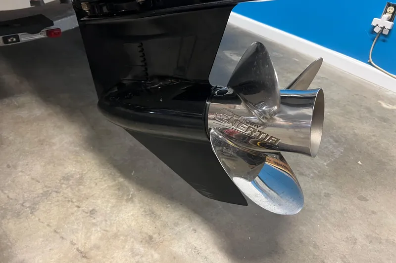 Slide: The Image of Close-up of a 2019 Boston Whaler 170 Montauk boat propeller in a garage setting. - 7