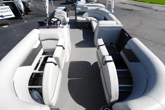 Slide: The Image of 2021 Crest Classic DLX 200 L pontoon boat interior with spacious seating and modern design. - 10