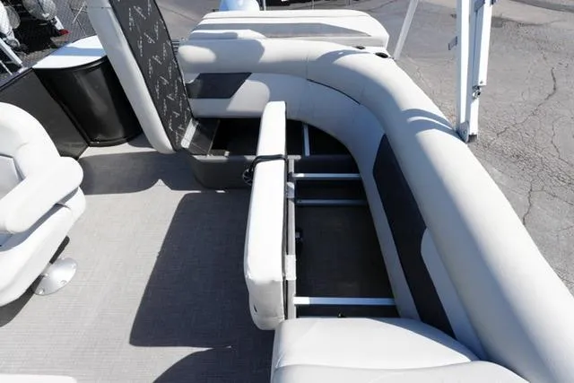 Slide: The Image of 2021 Crest Classic DLX 200 L pontoon boat interior with spacious seating and storage. - 15