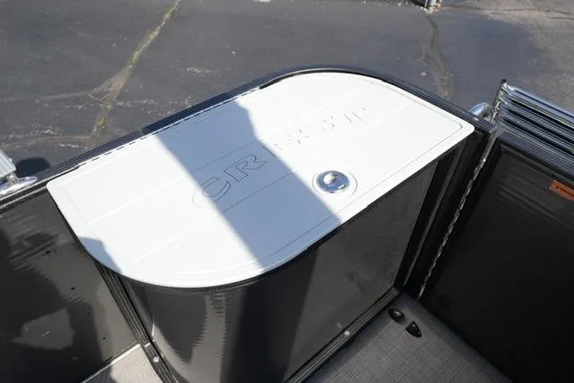 Slide: The Image of 2021 Crest Classic DLX 200 L boat storage compartment with sleek design and secure latch. - 17