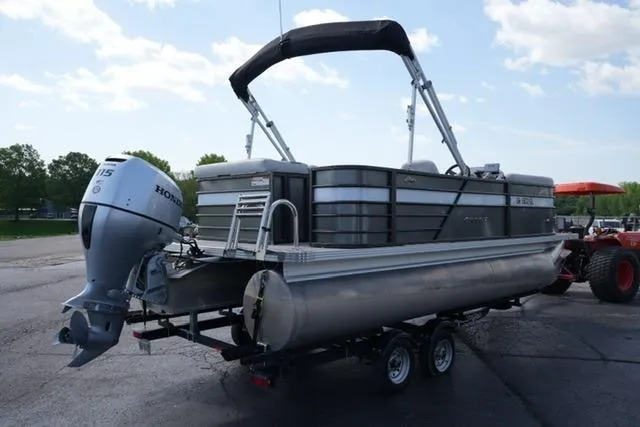 Slide: The Image of 2021 Crest Classic DLX 200 L pontoon boat with Honda outboard motor on trailer. - 5