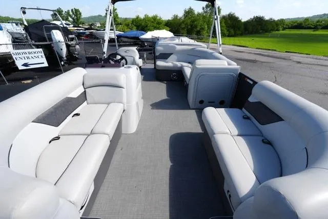 Slide: The Image of 2021 Crest Classic DLX 200 L pontoon boat with spacious seating and modern design. - 8