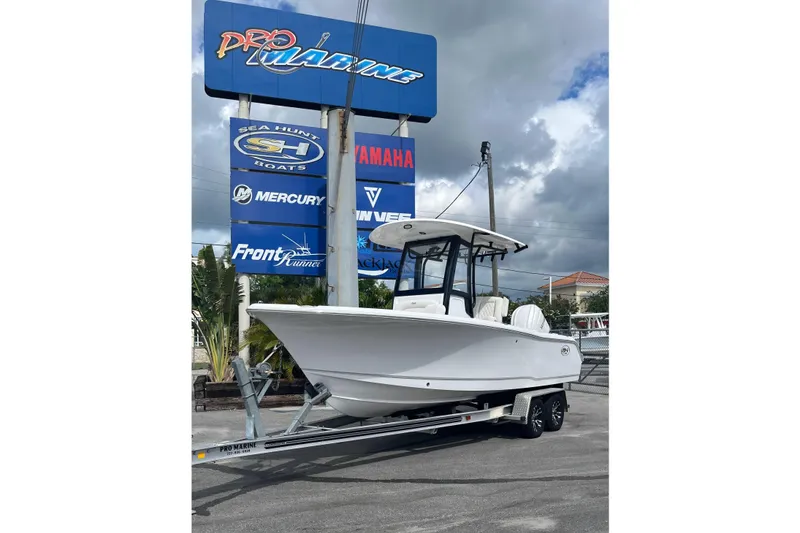 The Image of 2026 Sea Hunt Ultra 235 SE boat on trailer at Pro Marine dealership. - 0