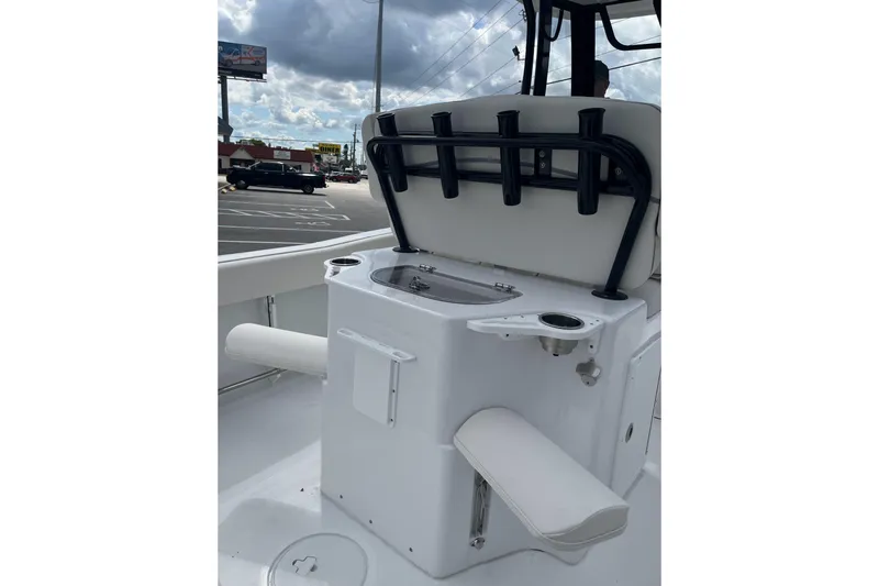 Slide: The Image of 2026 Sea Hunt Ultra 235 SE boat interior with seating and rod holders. - 10