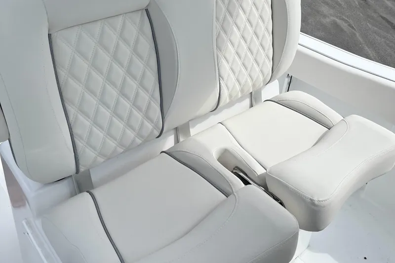 Slide: The Image of Luxurious seating on 2026 Sea Hunt Ultra 235 SE boat with diamond-stitched upholstery. - 12