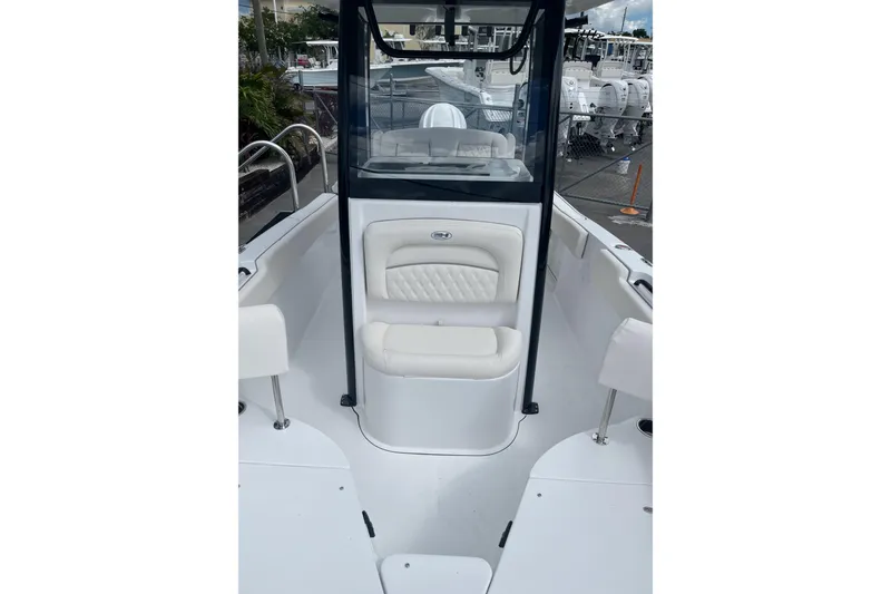 Slide: The Image of 2026 Sea Hunt Ultra 235 SE boat interior with white seating and sleek design. - 20