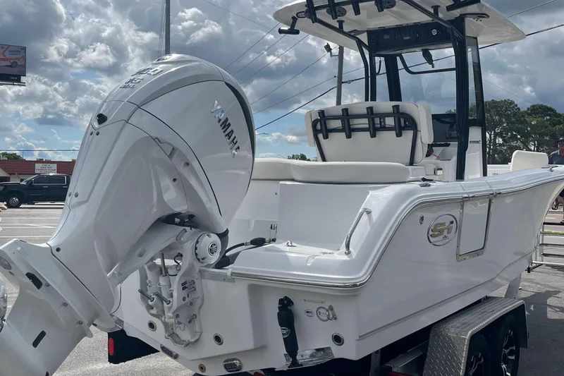 Slide: The Image of 2026 Sea Hunt Ultra 235 SE boat with Yamaha outboard motor on trailer. - 5