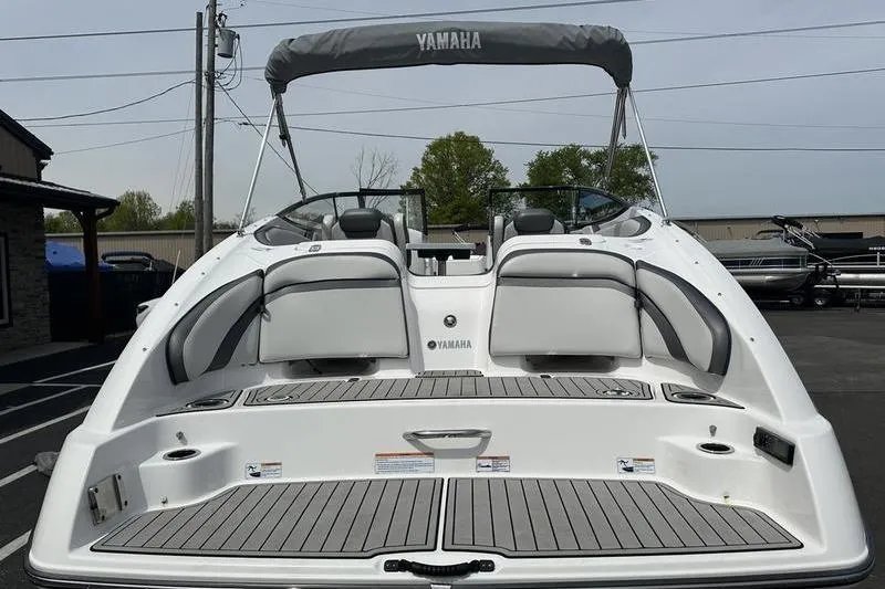 Slide: The Image of 2020 Yamaha Boats SX240, rear view, showcasing spacious deck and seating area. - 10