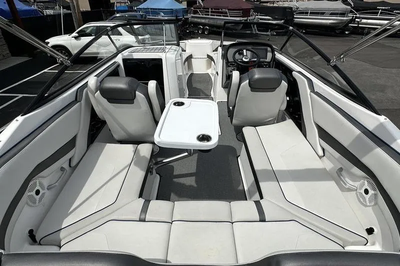 Slide: The Image of 2020 Yamaha Boats SX240 interior with seating and table, showcasing modern design and comfort. - 14