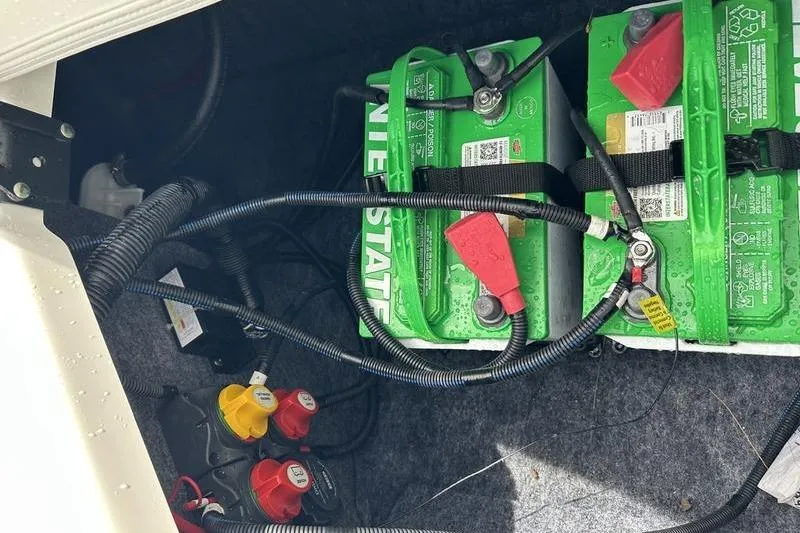 Slide: The Image of Battery compartment of a 2020 Yamaha Boats SX240 with wiring and connectors. - 15