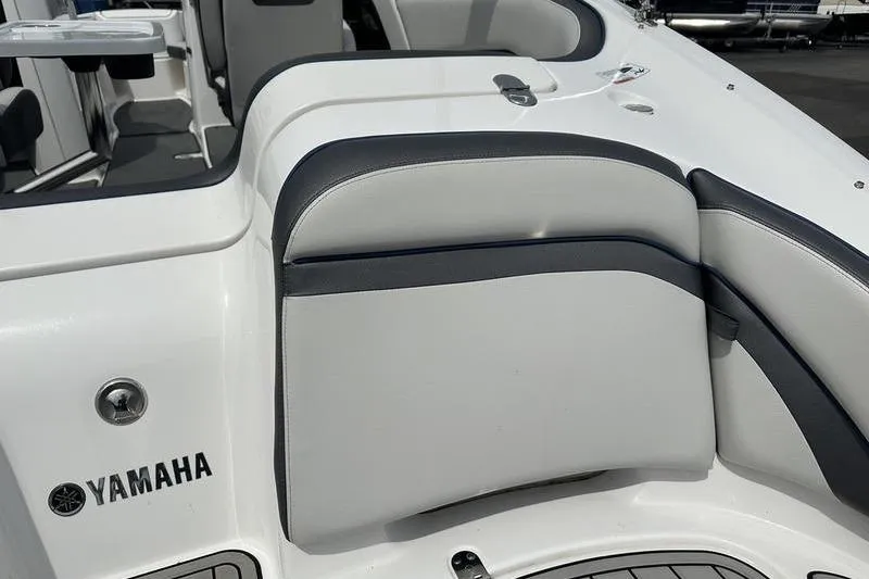 Slide: The Image of 2020 Yamaha SX240 boat interior with sleek white and gray seating design. - 17