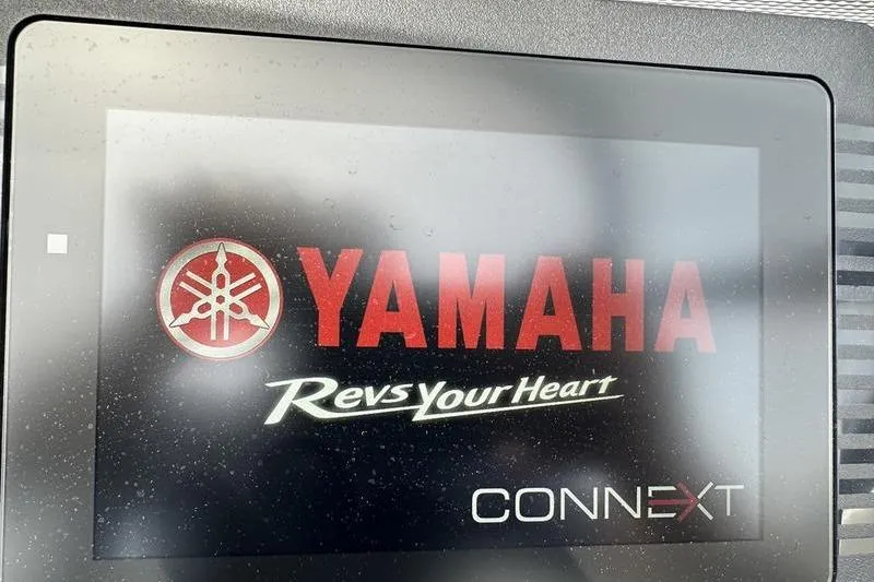 Slide: The Image of Yamaha Boats SX240 2020 dashboard display with "Revs Your Heart" and Connext logo. - 18