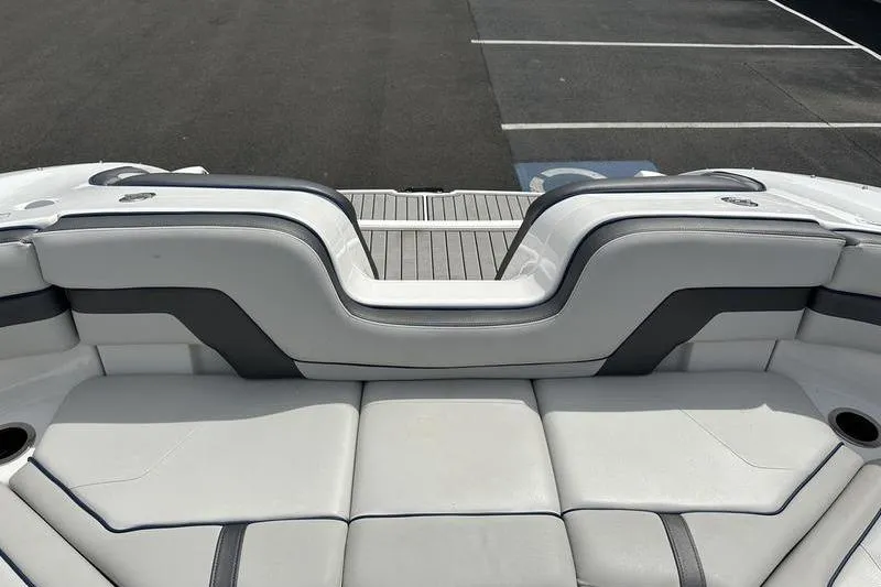 Slide: The Image of 2020 Yamaha Boats SX240 interior with sleek white seating and modern design. - 20